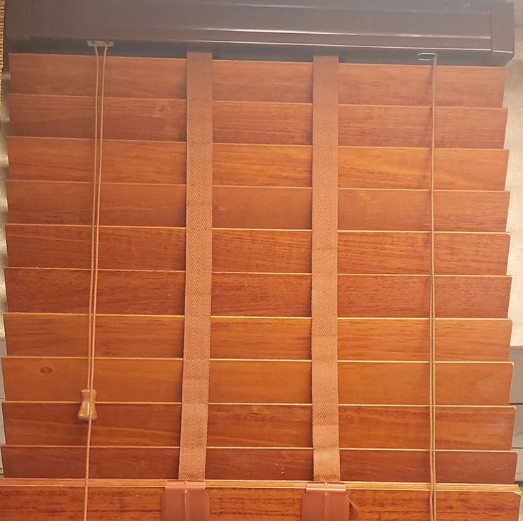 Wooden venetian blinds in warm daylight