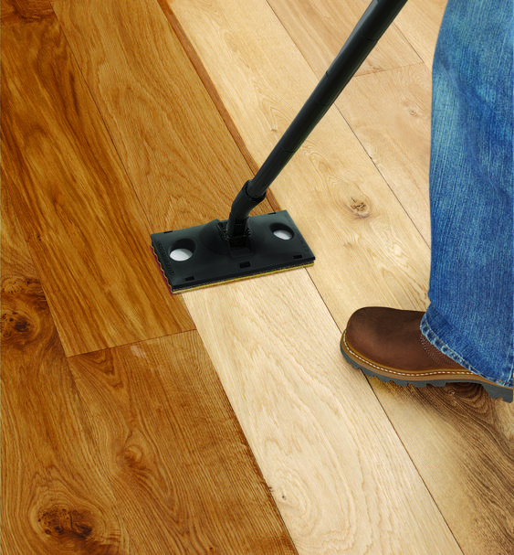 Finished wooden flooring across a completed room