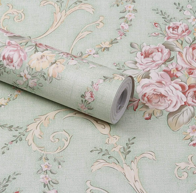 Patterned wallpaper hung across a living room wall